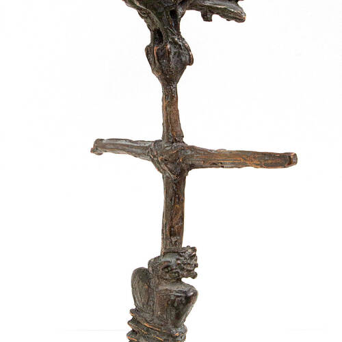 Bronze sculpture of a man tied to a pole with a creature on the top.